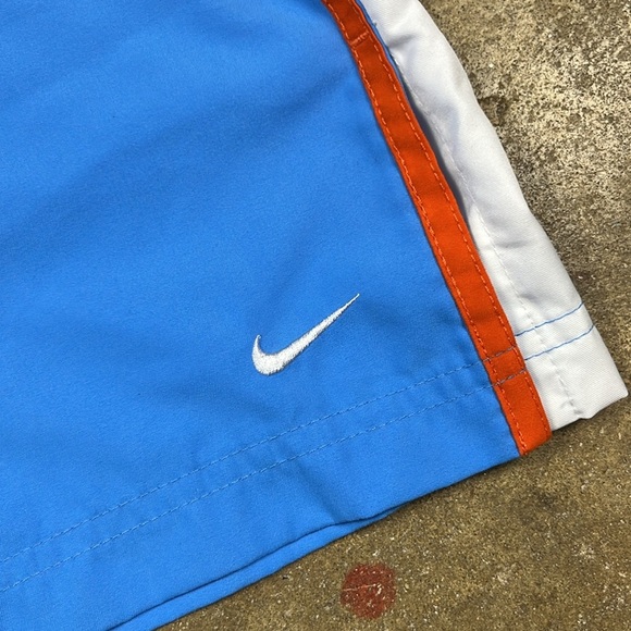 Vintage Nike Cropped Blue Pants with Orange and White Stripes
Size: small - Picture 5 of 7